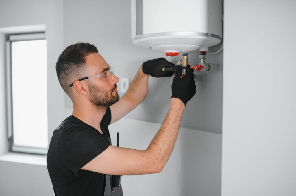 Technician performing water heater maintenance in Gibsonton